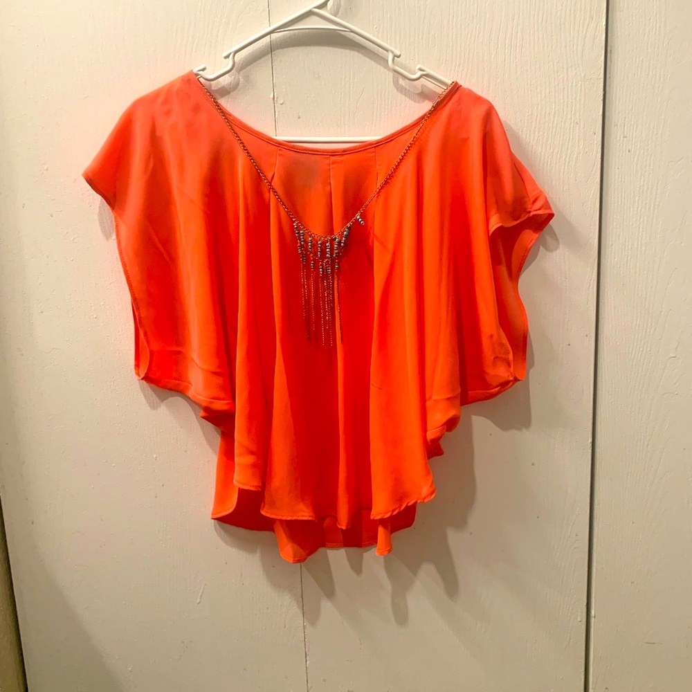 Women’s beautiful coral blouse with necklace
